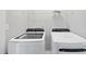 Convenient laundry room featuring new front load washer and dryer at 84 Ripple Way # 313, Clayton, NC 27520