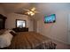 Bedroom boasts a mounted flat screen television for entertainment at 8505 Tierra Del Sol Way, Raleigh, NC 27616