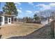 Spacious backyard features a privacy fence, mature trees and a storage shed at 89 Bison Ln, Lillington, NC 27546