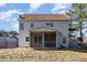 Home's backyard featuring covered porch, patio and privacy fence at 89 Bison Ln, Lillington, NC 27546