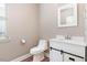 Bathroom with a vanity, sliding door, and bright, natural light at 89 Bison Ln, Lillington, NC 27546