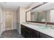 Bathroom features double bowl sinks, a large mirror and tile floors at 89 Bison Ln, Lillington, NC 27546