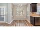 Dining area with backyard view, modern lighting, and stainless steel appliances at 89 Bison Ln, Lillington, NC 27546