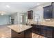 Bright kitchen with granite island, sleek appliances, and ample counter space at 89 Bison Ln, Lillington, NC 27546