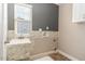 Functional laundry room with window, sink and ample wall cabinet space at 89 Bison Ln, Lillington, NC 27546