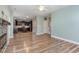 Open living room features wood floors, ceiling fan and an open floor plan at 89 Bison Ln, Lillington, NC 27546