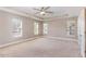 Spacious main bedroom with recessed ceiling, multiple windows, and ample natural light at 89 Bison Ln, Lillington, NC 27546