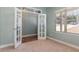 Office with french doors, carpeted floors, and a large window for natural light at 89 Bison Ln, Lillington, NC 27546