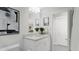 This is a well-lit bathroom featuring a white cabinet and mirror at 905 Myers Point Dr, Morrisville, NC 27560