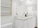 Bright bathroom with white vanity with double sinks and a modern decor at 905 Myers Point Dr, Morrisville, NC 27560