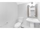 Modern half bathroom features a pedestal sink and classic toilet at 905 Myers Point Dr, Morrisville, NC 27560