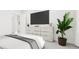 Bedroom featuring a dresser with a TV and a potted plant at 905 Myers Point Dr, Morrisville, NC 27560