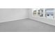 Bright bedroom with gray carpet and large windows at 905 Myers Point Dr, Morrisville, NC 27560