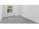 Bedroom with gray carpet and a large window at 905 Myers Point Dr, Morrisville, NC 27560