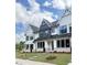 Beautiful white townhouse with stone accents, modern windows, and well-maintained landscaping at 905 Myers Point Dr, Morrisville, NC 27560