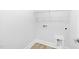 White laundry room with space for washer and dryer at 905 Myers Point Dr, Morrisville, NC 27560