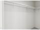 Empty walk-in closet, featuring white walls and shelving at 905 Myers Point Dr, Morrisville, NC 27560
