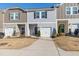 Townhome with grey siding, white trim, and single car garage at 907 Field Ivy Dr, Fuquay Varina, NC 27526