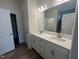 Bathroom featuring double sinks with white cabinets and countertops at 97 Willow Cameron Way, Angier, NC 27501