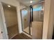 An elegant bathroom showcases a glass-enclosed shower with tile surround at 97 Willow Cameron Way, Angier, NC 27501
