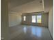 Large bedroom with tray ceilings and large windows offering ample natural light and neighborhood views at 97 Willow Cameron Way, Angier, NC 27501