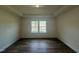 Well-lit bedroom with coffered ceilings, recessed lights, and two large windows at 97 Willow Cameron Way, Angier, NC 27501