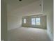 The bedroom features a tray ceiling and two windows for an airy feel at 97 Willow Cameron Way, Angier, NC 27501