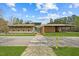 Beautiful community building with modern architecture, ample green space, and a pedestrian crosswalk at 97 Willow Cameron Way, Angier, NC 27501