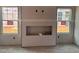 Unfinished living room with a modern fireplace and ample natural light at 97 Willow Cameron Way, Angier, NC 27501
