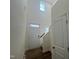 Bright foyer featuring hardwood floors, a staircase, and a clerestory window for lots of natural light at 97 Willow Cameron Way, Angier, NC 27501