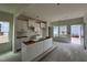 View of unfinished kitchen with white cabinets and a large island at 97 Willow Cameron Way, Angier, NC 27501
