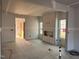 Spacious unfinished living room featuring a fireplace and natural light at 97 Willow Cameron Way, Angier, NC 27501