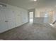 Spacious loft area with plush carpeting, multiple closets, and ample natural light, creating a versatile space at 97 Willow Cameron Way, Angier, NC 27501