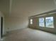 Large main bedroom featuring tray ceiling and abundant natural light at 97 Willow Cameron Way, Angier, NC 27501