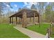 Covered picnic shelter with stone columns and wooden beams in a park setting at 97 Willow Cameron Way, Angier, NC 27501