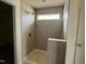 Modern shower with a built-in bench and window, showcasing a blend of comfort and natural light at 97 Willow Cameron Way, Angier, NC 27501