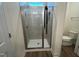 Tiled shower stall enclosed with glass in the bathroom at 97 Willow Cameron Way, Angier, NC 27501