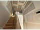 Unfinished staircase with wooden steps and drywall walls at 97 Willow Cameron Way, Angier, NC 27501