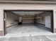 Spacious two-car garage with ample storage space, shelving, and work area at 102 Westchase Dr, Clayton, NC 27527