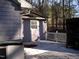 Spacious wooden deck in backyard with a view of the surrounding trees at 105 Lake Rd, Henderson, NC 27537