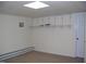 Finished basement with built-in shelving and carpeting at 105 Lake Rd, Henderson, NC 27537
