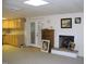 Finished basement area with a fireplace, kitchenette, and access to the exterior at 105 Lake Rd, Henderson, NC 27537