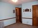 Bedroom showcasing neutral carpeting, light blue walls with chair rail, and a closet with folding doors at 105 Lake Rd, Henderson, NC 27537