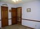 Bedroom with two closets, a door to another room, and neutral walls and flooring at 105 Lake Rd, Henderson, NC 27537