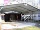 Exterior view of a carport connected to the residence at 105 Lake Rd, Henderson, NC 27537