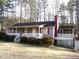 Charming single-story home with a spacious front porch and well-maintained landscaping at 105 Lake Rd, Henderson, NC 27537