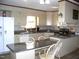 Bright kitchen featuring granite countertops, and ample cabinet space at 105 Lake Rd, Henderson, NC 27537