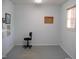 Office space featuring light blue walls, neutral carpeting, and natural light from the window at 105 Lake Rd, Henderson, NC 27537