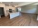 Open-concept kitchen, seamlessly flowing into a spacious living area with hardwood floors and ample natural light at 106 Little Creek Dr, Lillington, NC 27546
