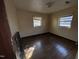 Empty bedroom featuring hardwood floors and natural light through the windows at 107 Creel St, Chapel Hill, NC 27516